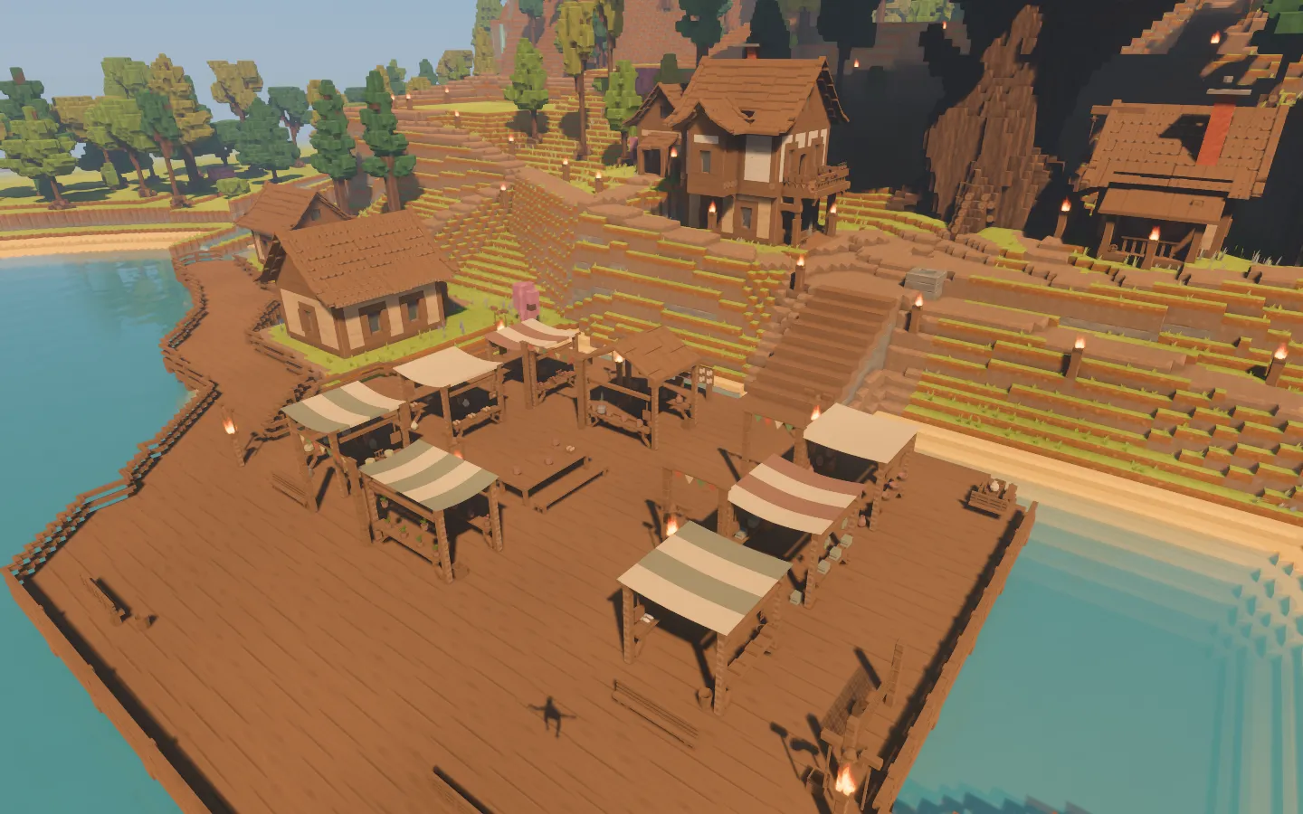 A timber market beside the lake, with canvas-covered stalls, counters, goods and an open central deck.