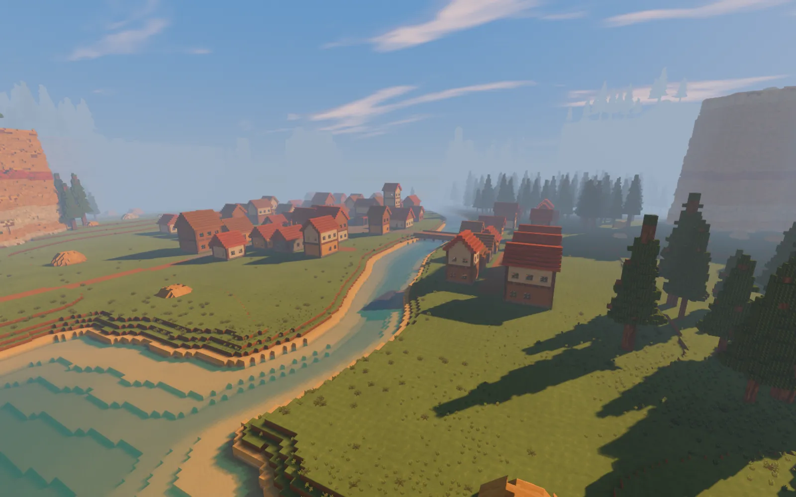 The first Brightsite valley, with a block-built town, pines and sandstone cliffs.